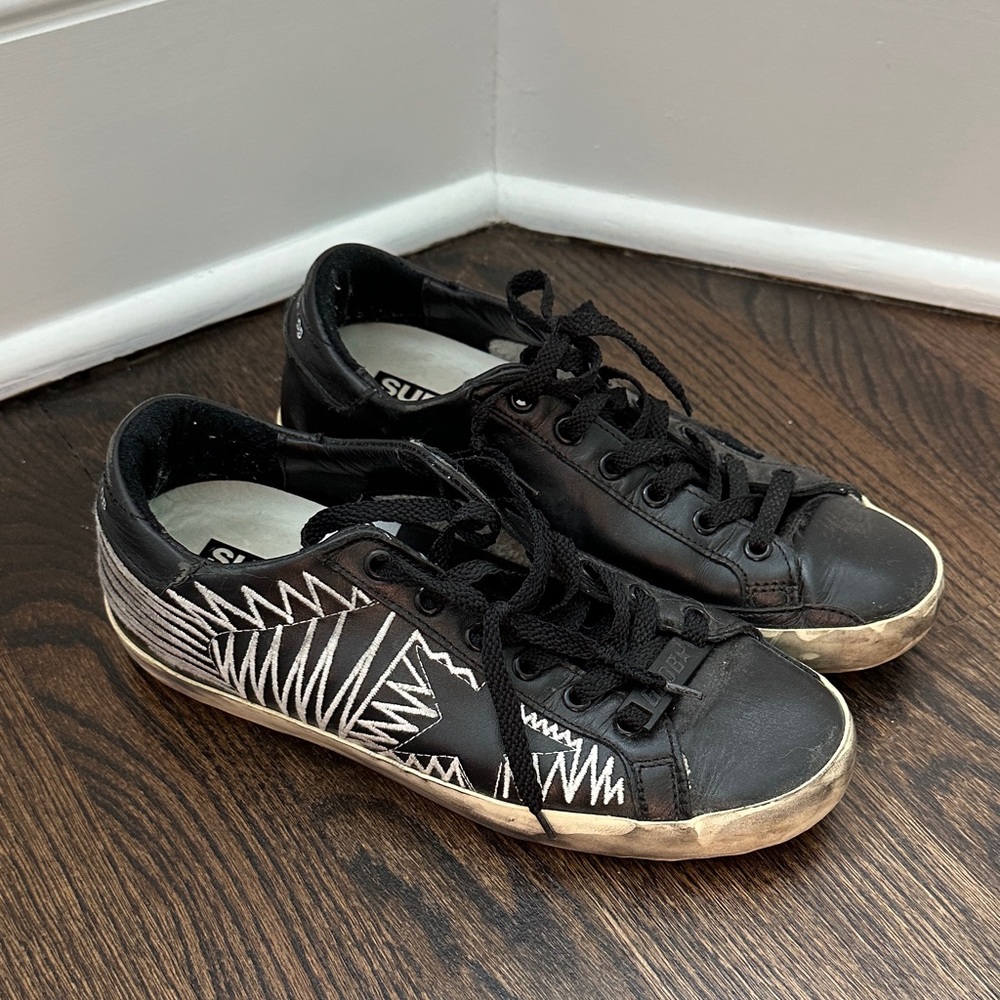 Golden Goose superstar distressed sneakers.